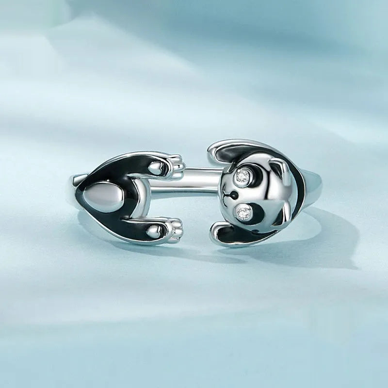 Adjustable sterling silver ring with a white gold plated panda design.