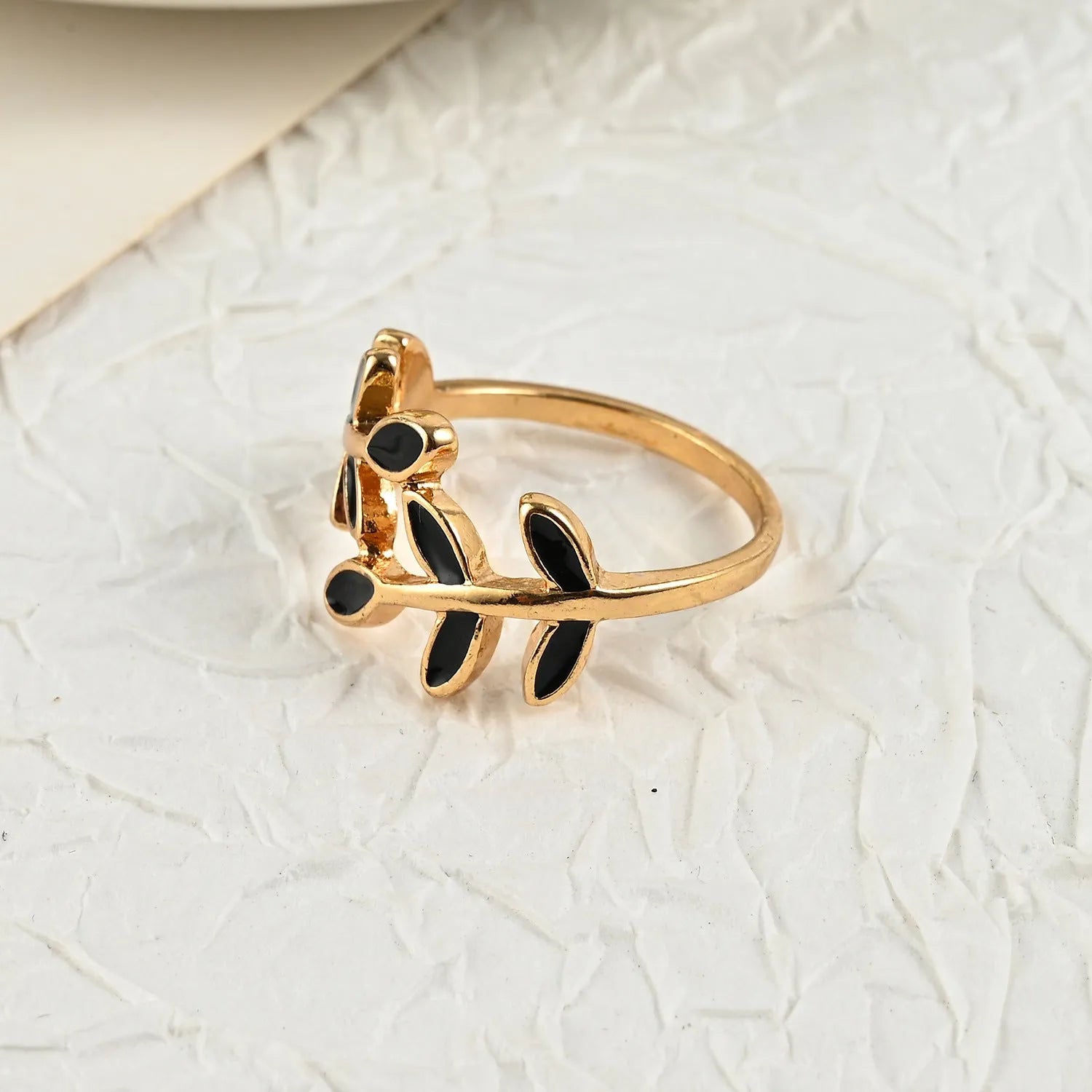 Gold electroplated geometric leaf ring with floral elements for women's index finger