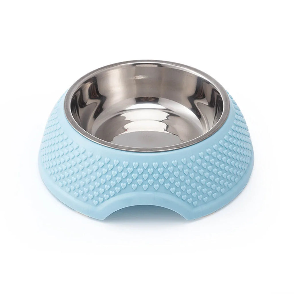 Blue stainless steel pet bowl with a non-slip weighted base on a floor.