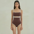 Brown triangle style one-piece swimsuit for women on a hanger