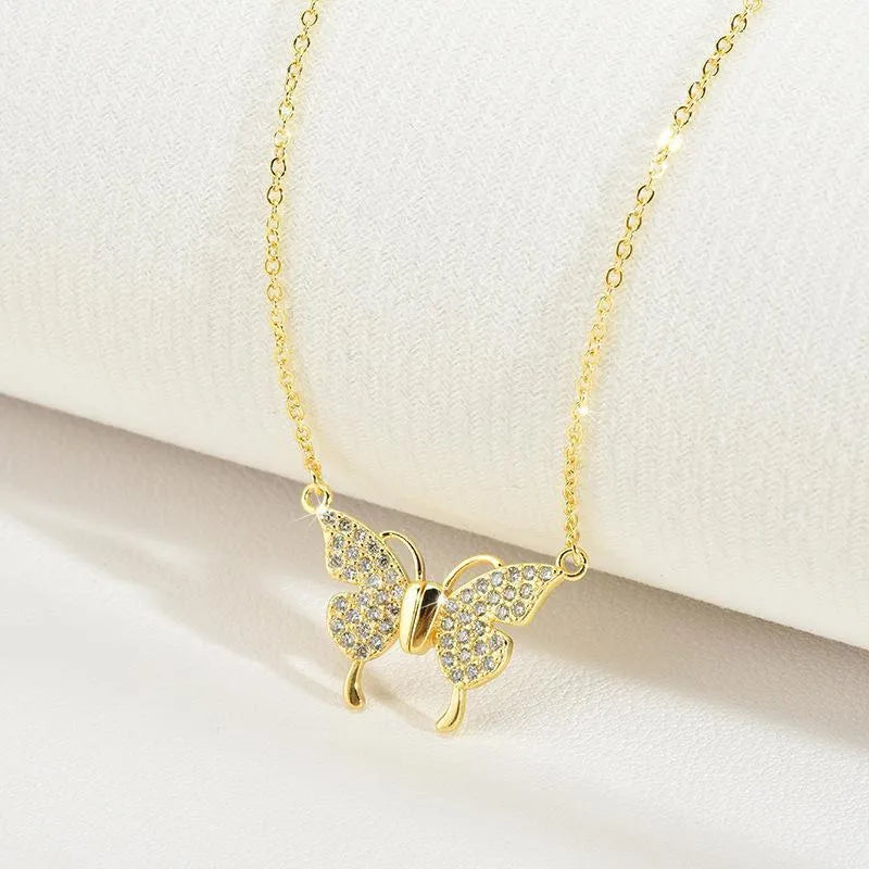 Women's twisted titanium steel clavicle chain with magnetic snap butterfly charm in gold finish