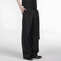 Black women's straight-leg trousers with a single pleat front and adjustable waistband on a hanger.