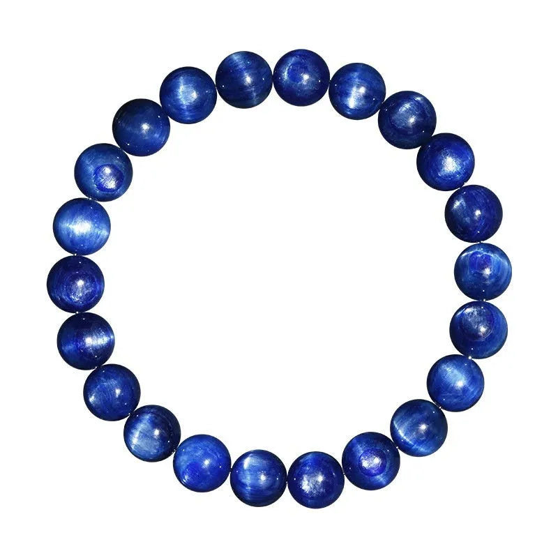 Polished blue crystal bracelet with geometric beads and Ruyi charm, shown in trade fair gifting context