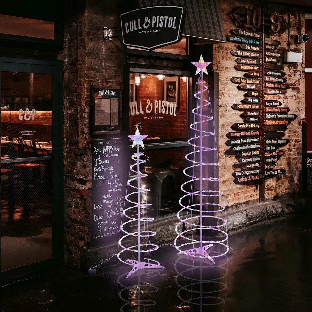 6FT tall LED spiral Christmas tree light set with remote control on a stand.