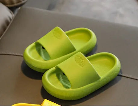 Children's bright coloured EVA slippers with a thick non-slip sole on a white background.
