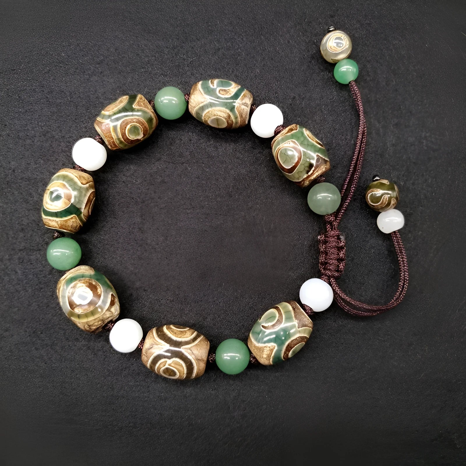 Green agate ethnic bracelet with hand-woven Tibetan beads and geometric patterns