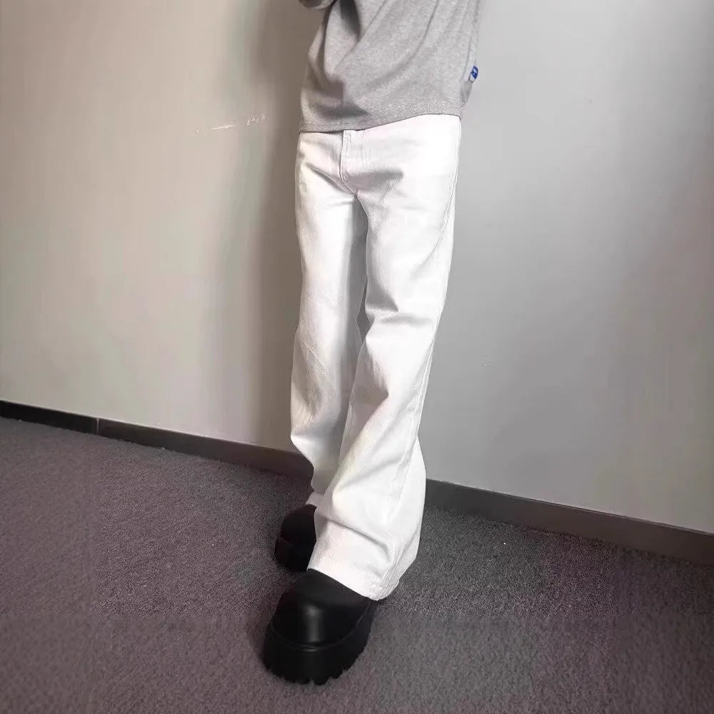 Men's loose fit straight wide leg white cotton denim jeans on a mid waist, showing zipper fly.