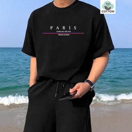 Men's loose fit cotton t-shirt with a printed letter design on the front, shown in apricot colour.