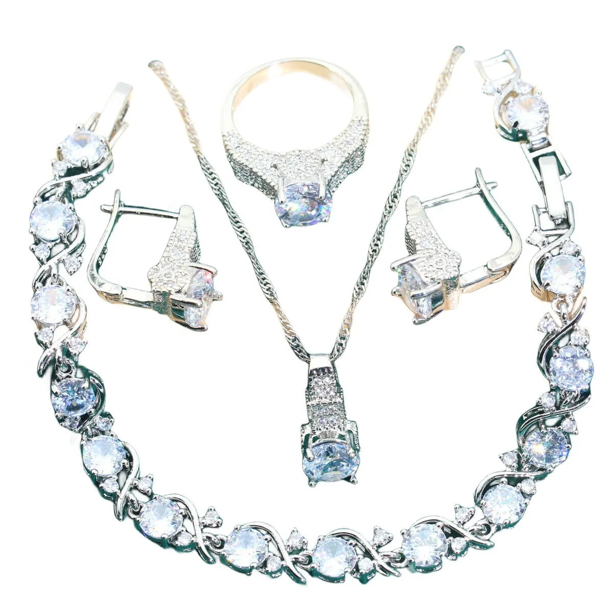 Four-piece bridal zircon jewellery set showing necklace with water wave chain, bracelet, earrings, and ring in alloy with coloured zircon stones