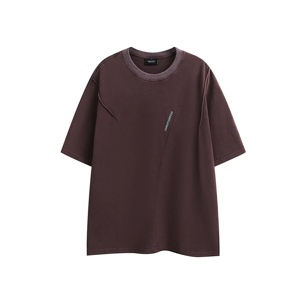 Purple loose-fit short-sleeved cotton t-shirt featuring an embroidered retro pattern on the chest.