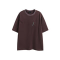 Purple loose-fit short-sleeved cotton t-shirt featuring an embroidered retro pattern on the chest.