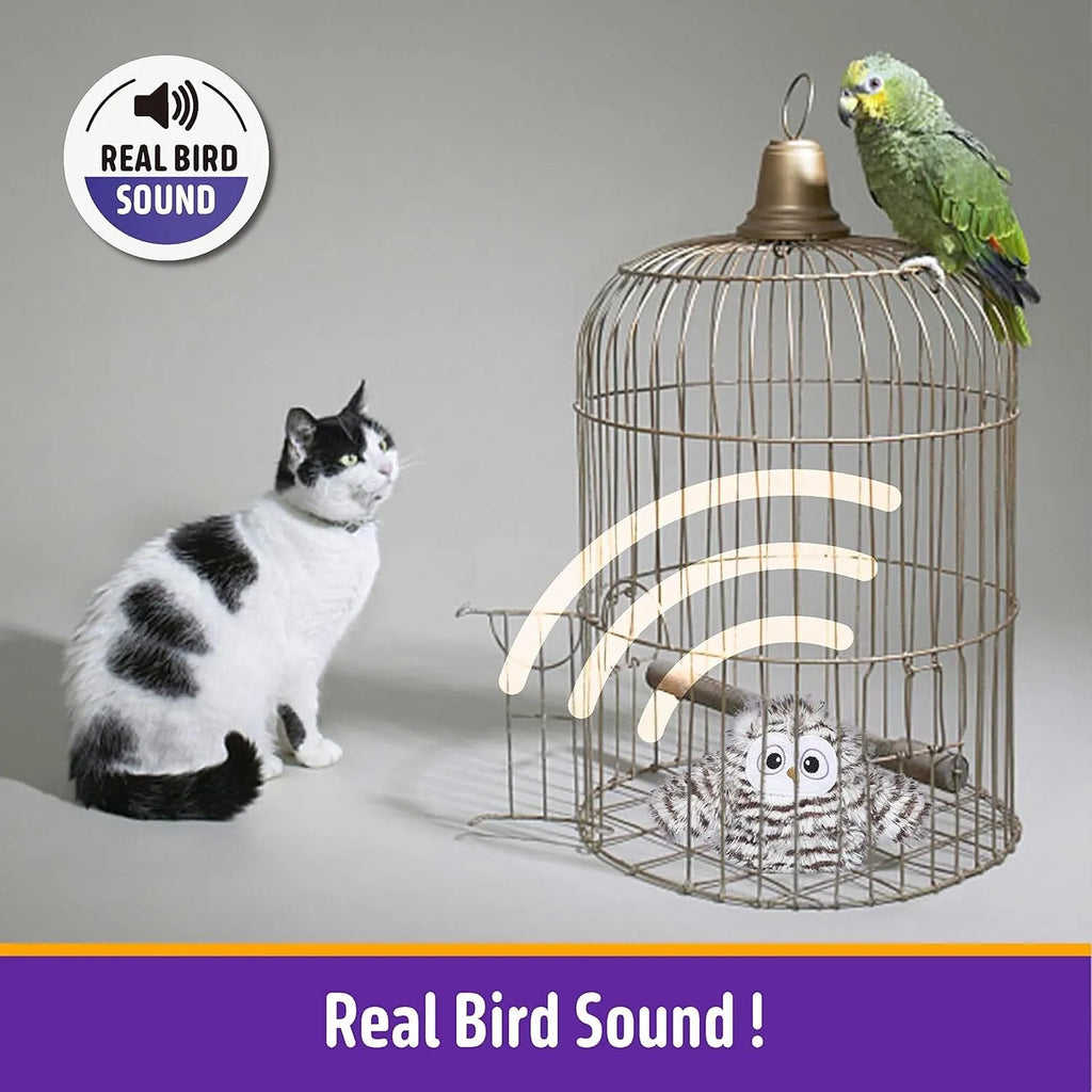Grey owl-shaped automatic cat toy with flapping wings on flat surface