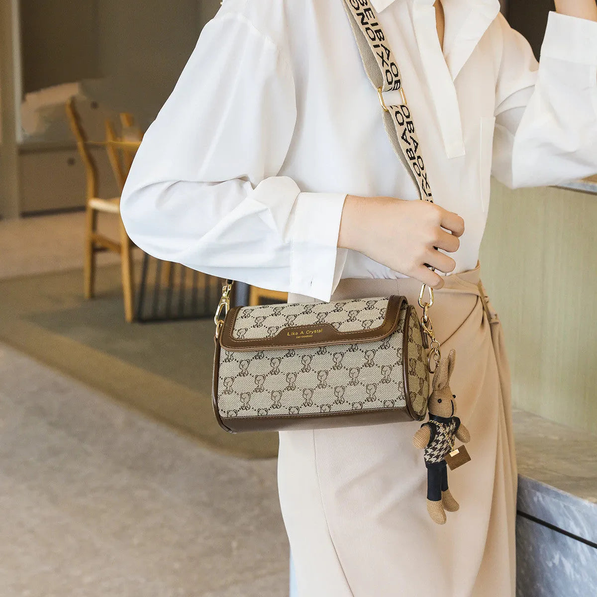 Khaki canvas square shoulder bag with cute bear design, woven letter and stitching details, 21x13x10cm