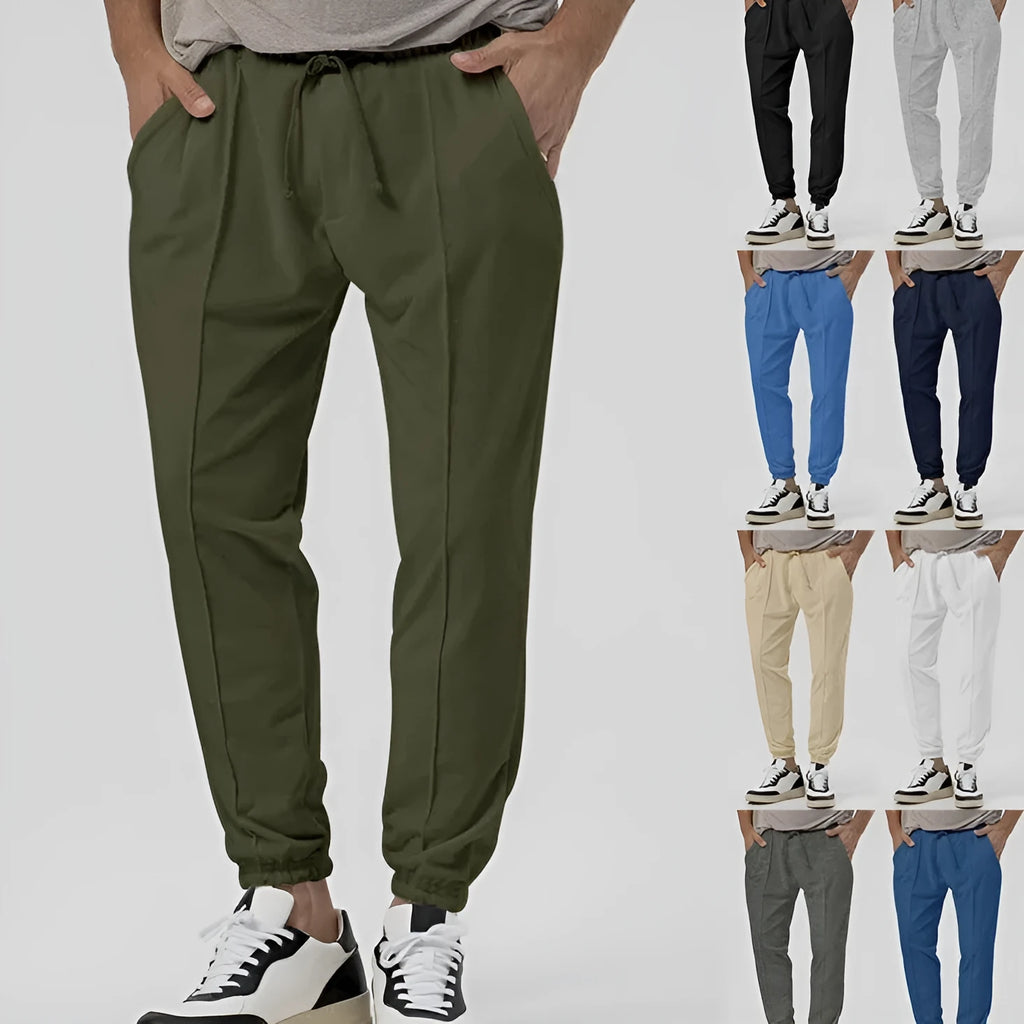 Men's grey cotton blend casual sweatpants with straight legs and a mid-rise waist on a hanger.