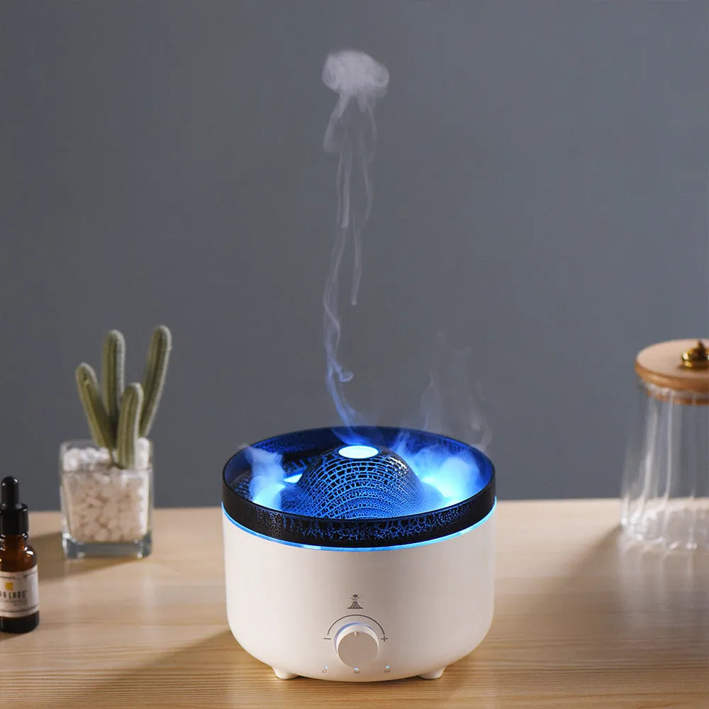 Small white volcano-shaped humidifier with simulated flame lighting and remote control on wooden table