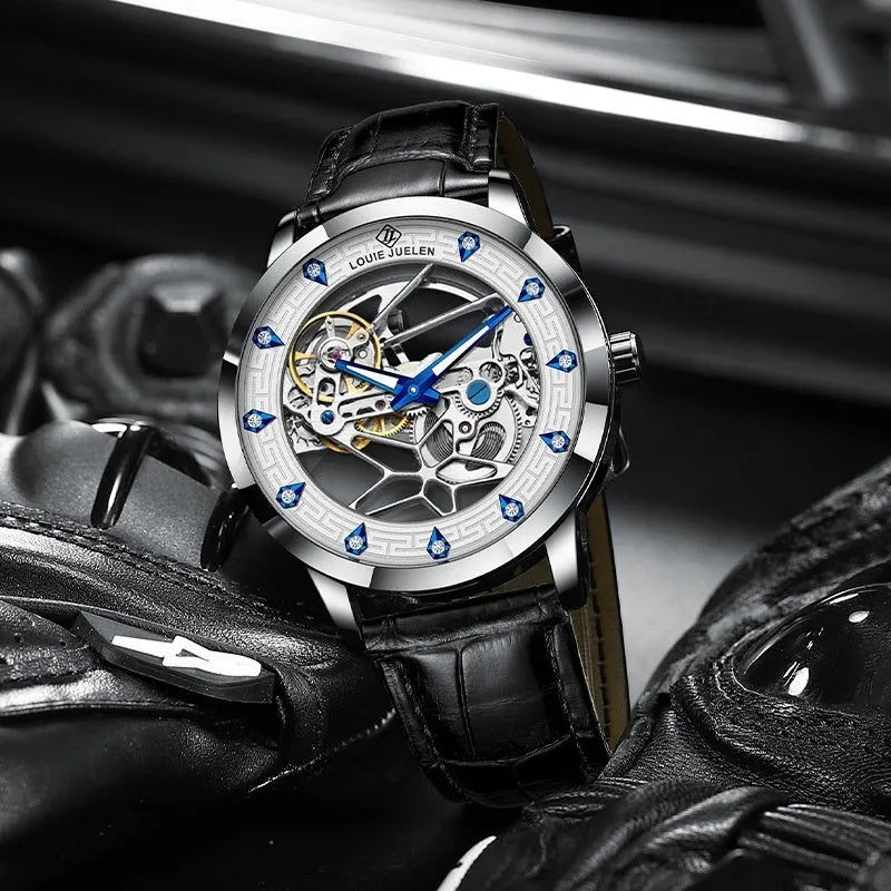 Men's silver case mechanical watch with white dial, blue hands, and black leather strap.