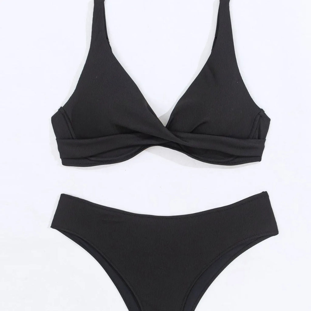 Women's solid colour bikini set in polyester rib fabric, shown on a hanger.