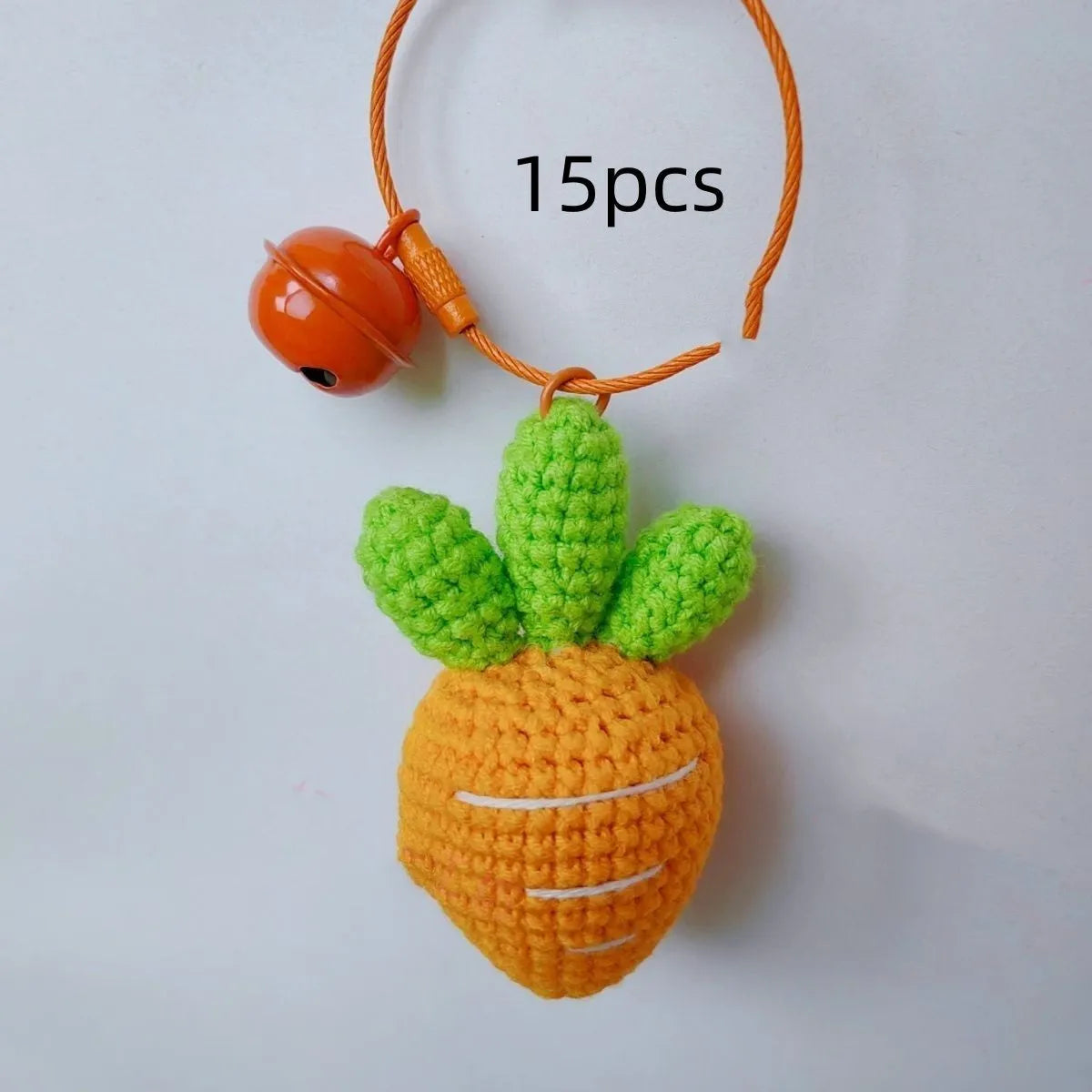Soft wool cartoon carrot shaped keychain pendant on a keyring.