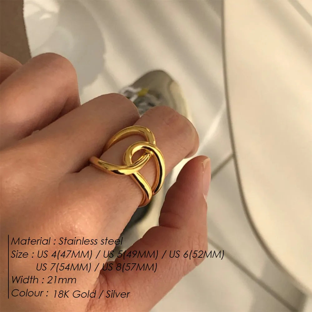 Women's stainless steel adjustable knotted ring in gold or steel colour on a U-shape geometric band.