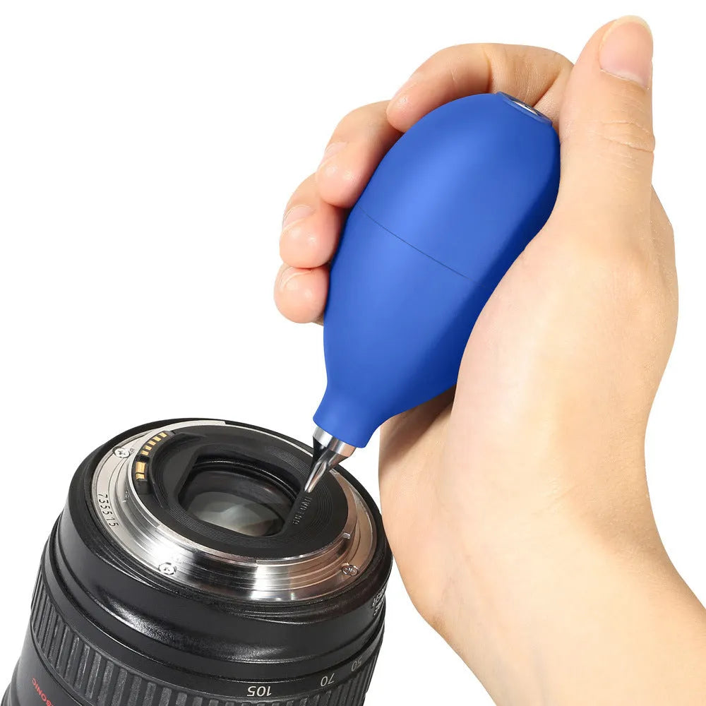 Blue handheld rubber dust removal blower ball for cleaning camera lenses and mobile phones.