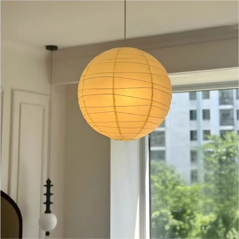 Japanese rice paper chandelier in living room setting showing soft ambient lighting