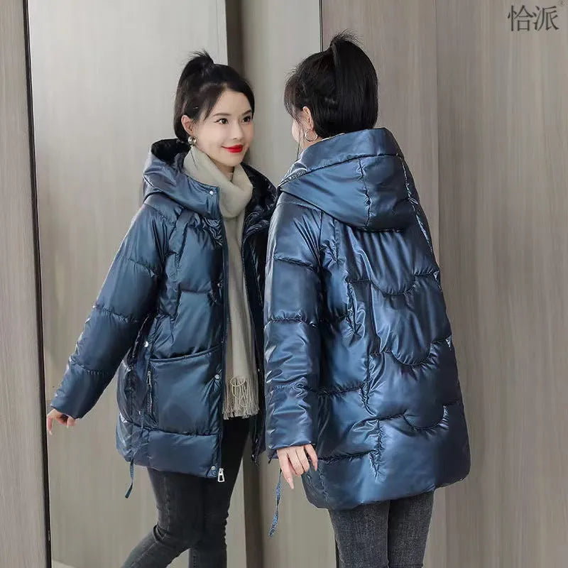 Women's loose thick hooded winter jacket in green, shown on a hanger.