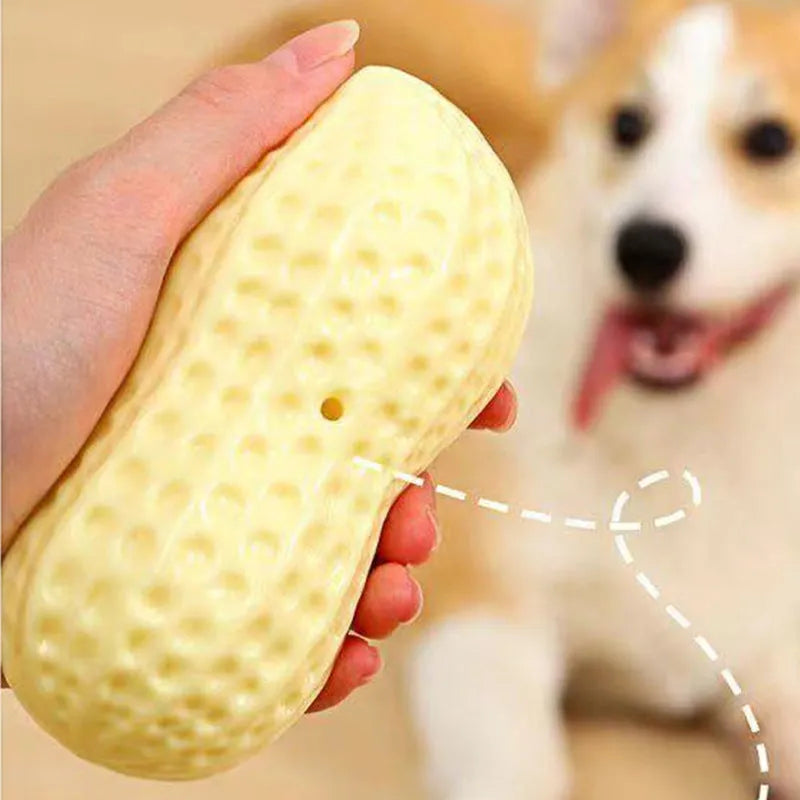 Yellow TPR peanut-shaped dog chew toy with textured surface for dental cleaning
