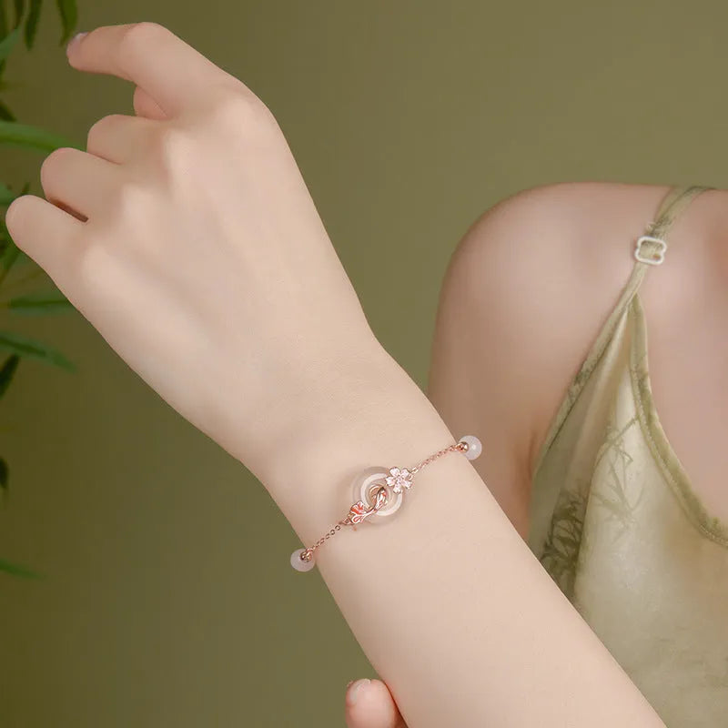 S925 sterling silver bracelet with white chalcedony crystal charm and koi fish design.