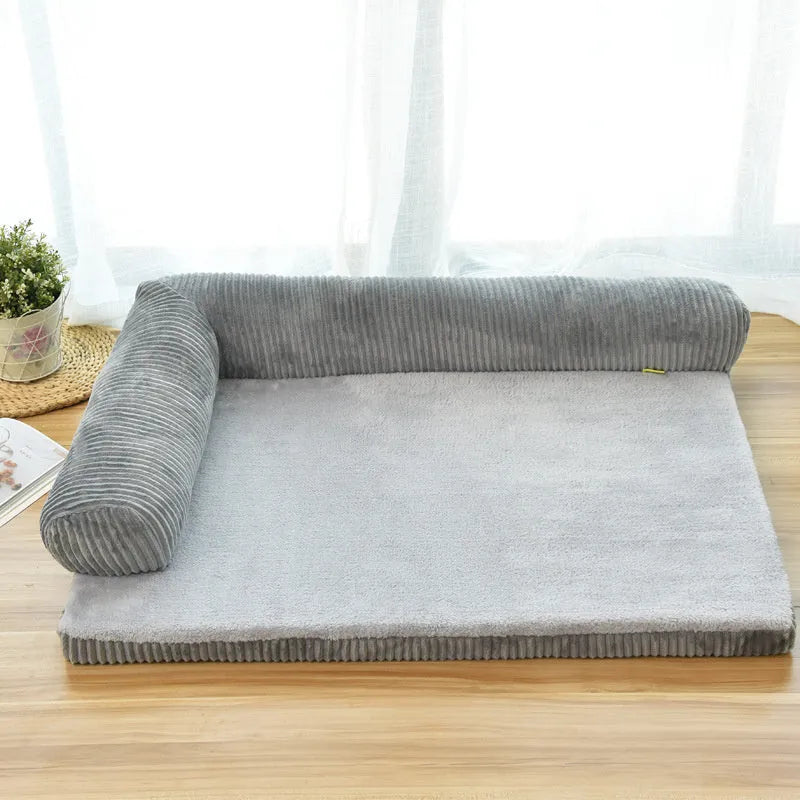 Corduroy bolster dog bed in grey colour with a non-slip base, shown in a large size for big dogs.