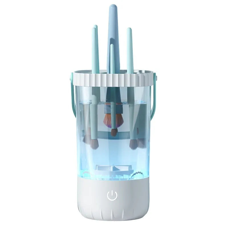 White rechargeable makeup brush cleaning device with USB cable.
