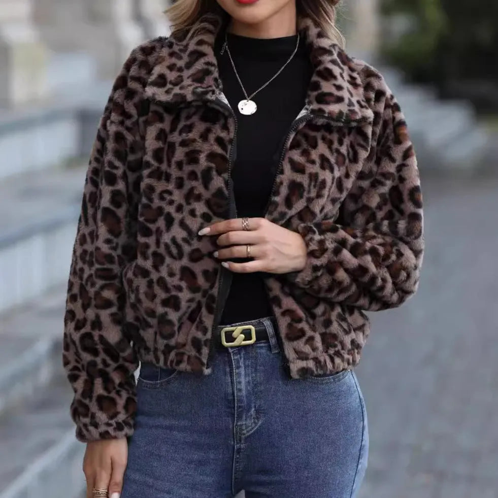 Women's loose leopard print plush coat with zip front and raglan sleeves.