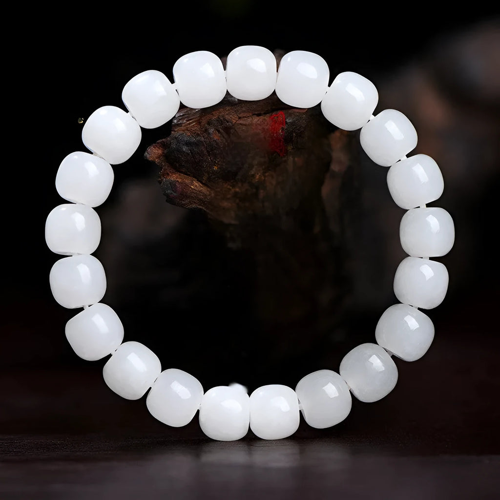 White jade barrel bead bracelet showing Hetian jade construction with traditional barrel beads