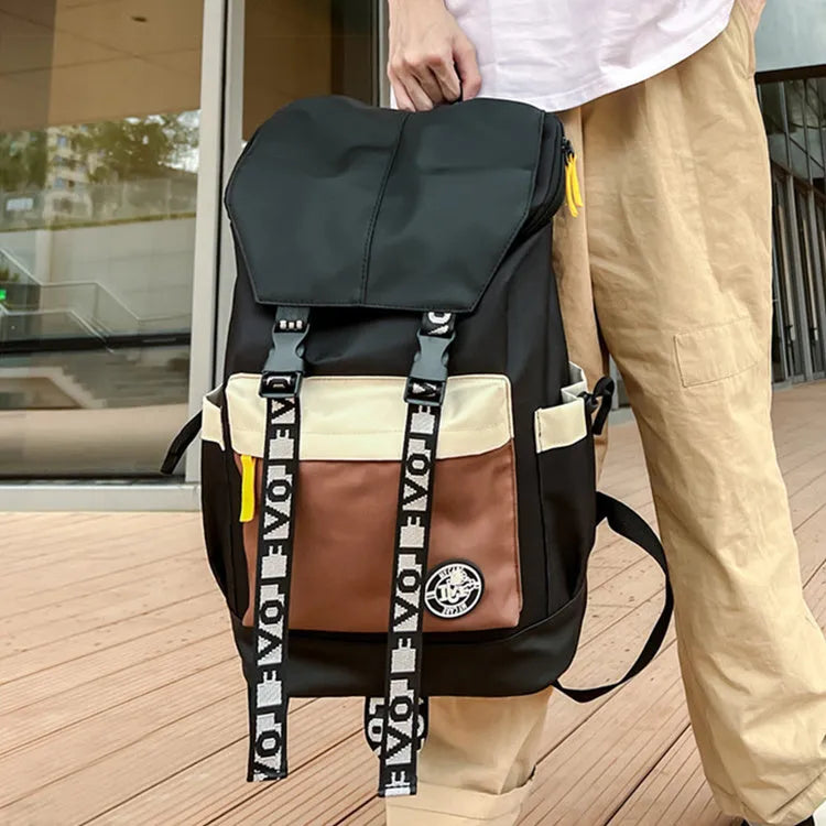 Oxford cloth school backpack showing black, green and red colour options with handheld and shoulder straps