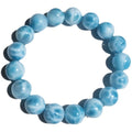 A blue sea-pattern natural crystal and pearl bodhi bracelet in Maillard style, showing bead detail.