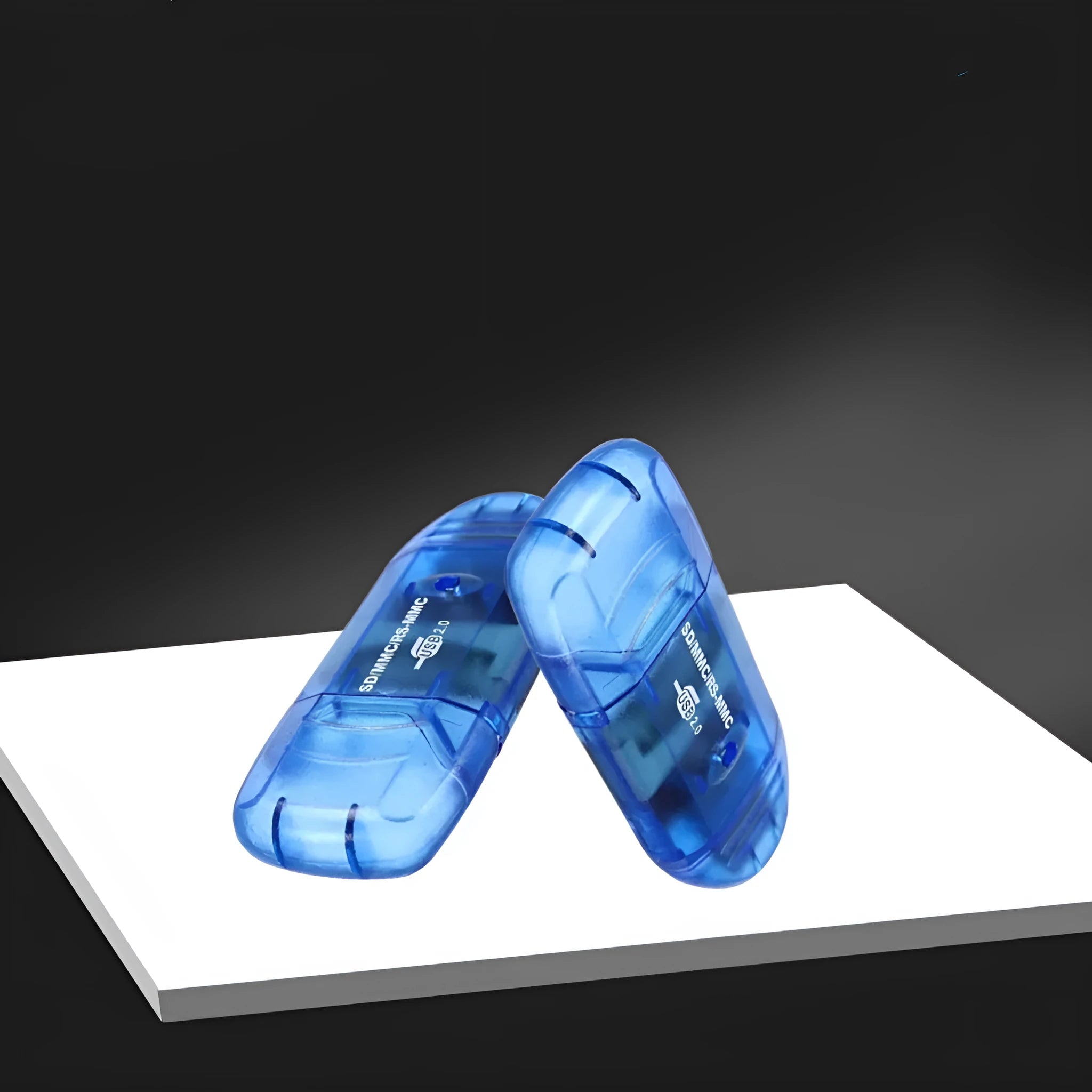 Transparent plastic USB card reader with optional LED light on a desk