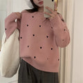 Women's loose long sleeve pink sweater with embroidered love pattern detail