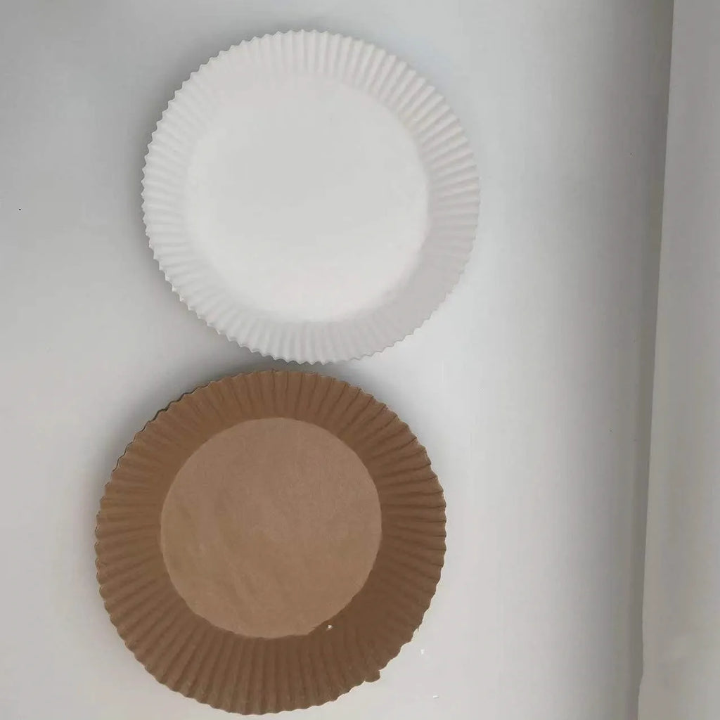 Round disposable paper liners for air fryers with 4.5cm high edges in white parchment colour