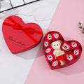 Red heart-shaped gift box open to show pink and red soap roses inside