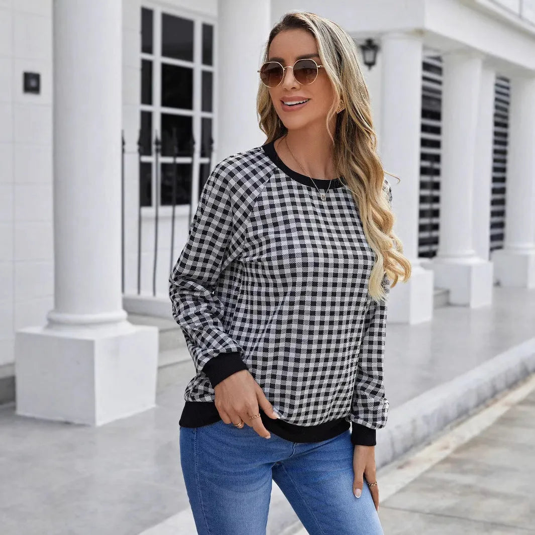 Black pullover sweater with Japanese plaid and printed stripe patterns, long sleeves