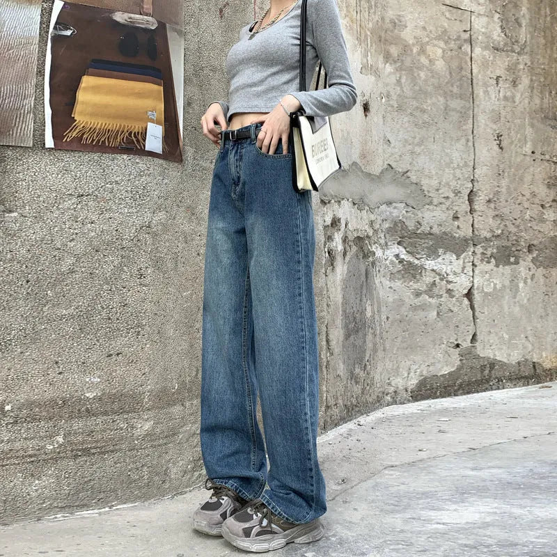 Women's high waist straight leg jeans in retro blue denim, shown on a model.