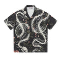 Short sleeve Cuban collar shirt with a snake bone and floral printed pattern in a loose fit.