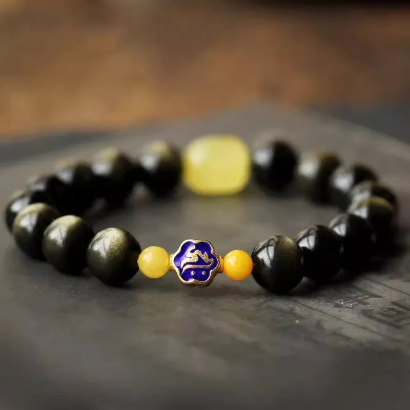 Golden obsidian bracelet with 10mm geometric zodiac beads on adjustable cord