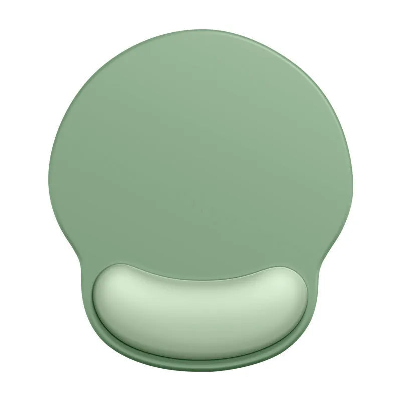 Silicone mouse mat with built-in wrist rest in a gradient colour option on a desk.