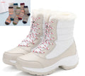 Women's high-top snow boots with cross strap, waterproof synthetic leather upper, and velvet lining, in black