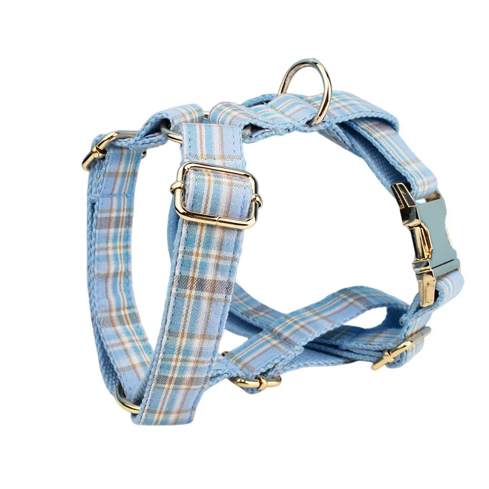 Sky blue grid forest pattern dog collar and leash set with matching vest and decorative bow.
