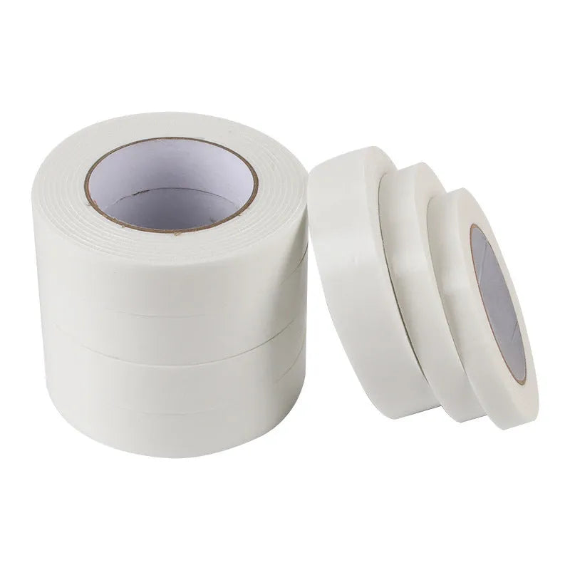 Roll of white foam double-sided adhesive tape showing its thickness, with size options 15mm, 18mm, and 30mm wide.