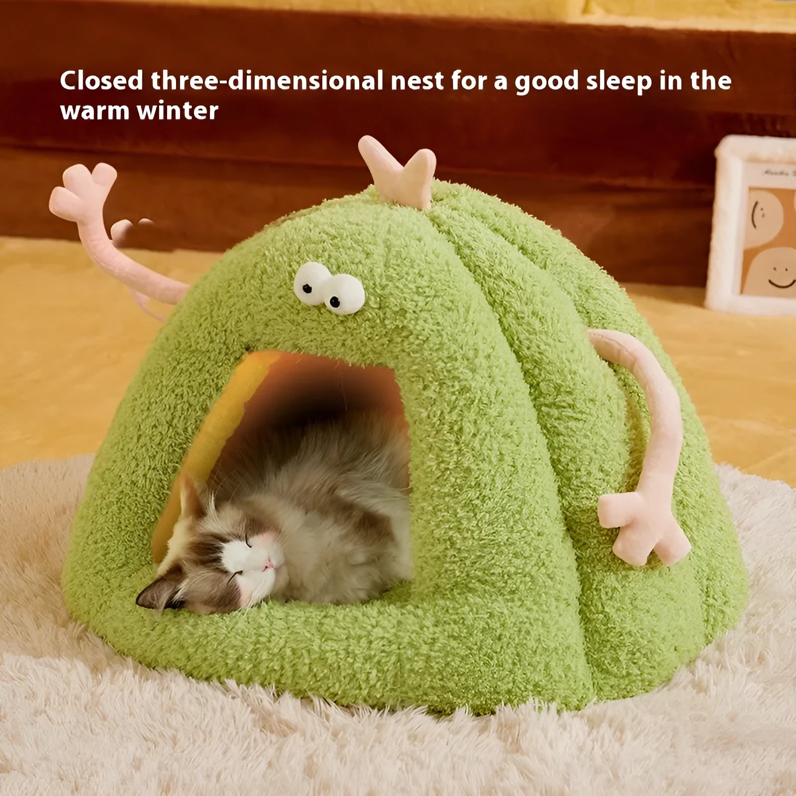 Green monster-shaped semi-enclosed cat kennel bed with ears and a removable cushion.