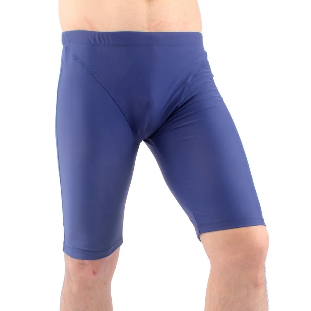 Men's green quick-drying nylon swimming trunks with loose five-point fit on a white background
