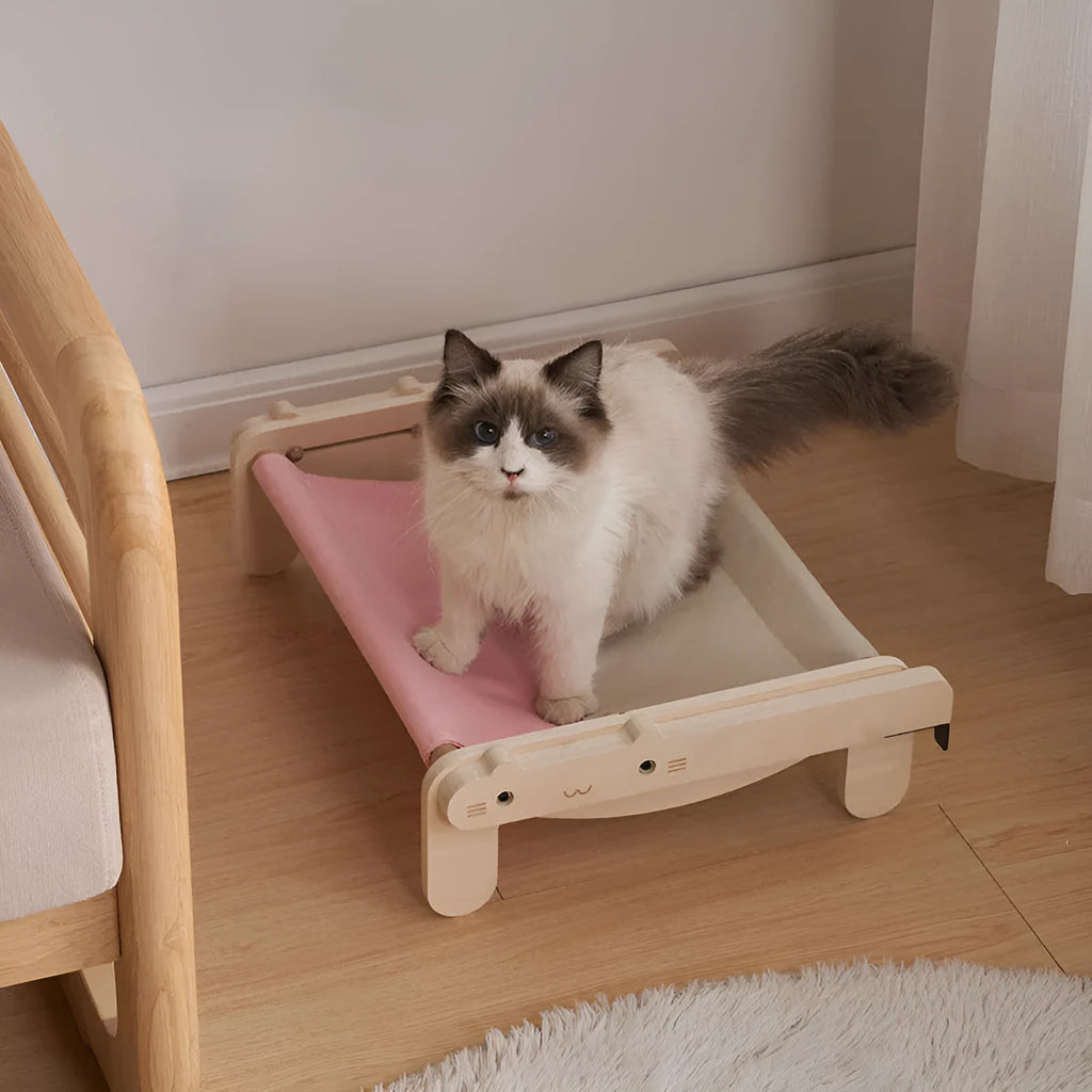 Solid wooden cat bed with removable fabric cover in selected colour option