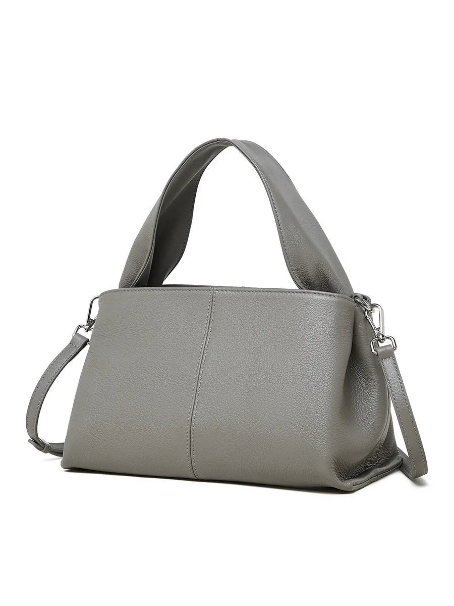 Genuine cowhide leather messenger bag in urban style with sandwich pocket and double straps.